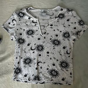 This is a medium sized black and white short sleeve top from Rue 21.